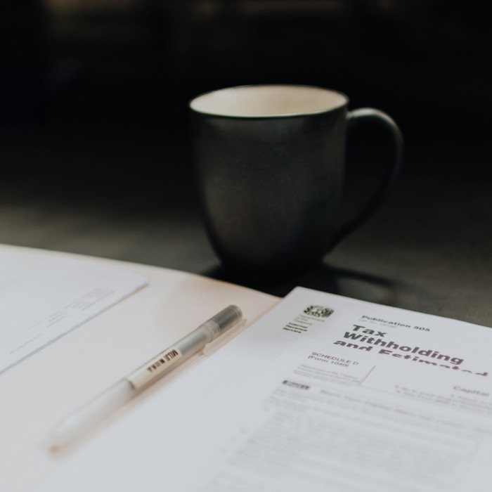 Financial professionals discussing tax strategies in an office